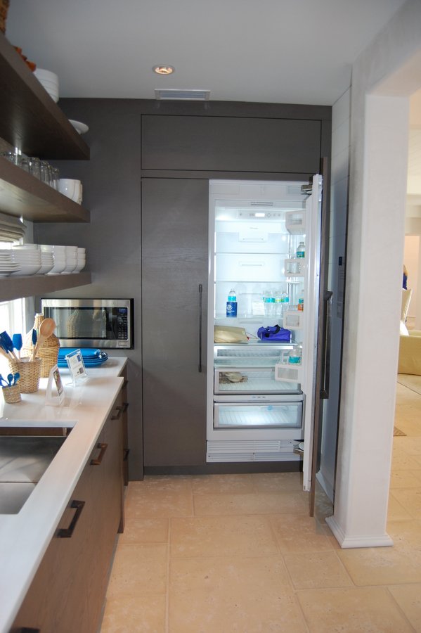 A stainless steel refrigerator in a kitchen