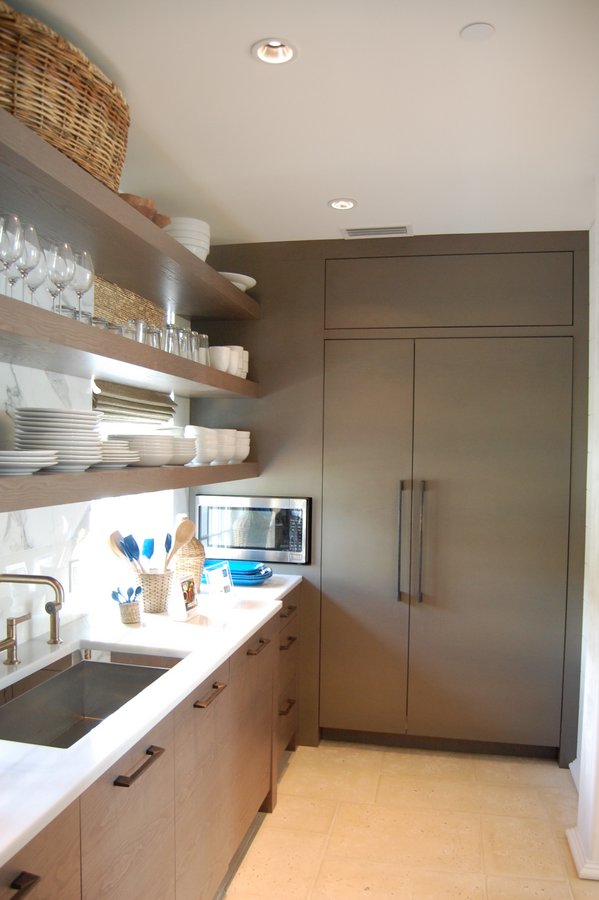 A kitchen with a sink and a microwave