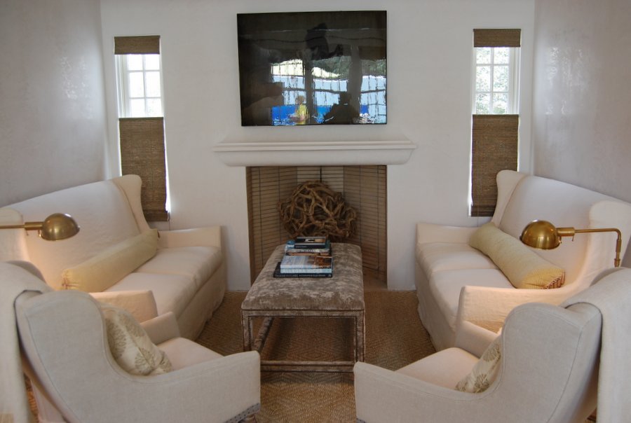 A living room filled with furniture and a fireplace