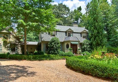 front exterior of Dutch Colonial style home for sale in Atlanta