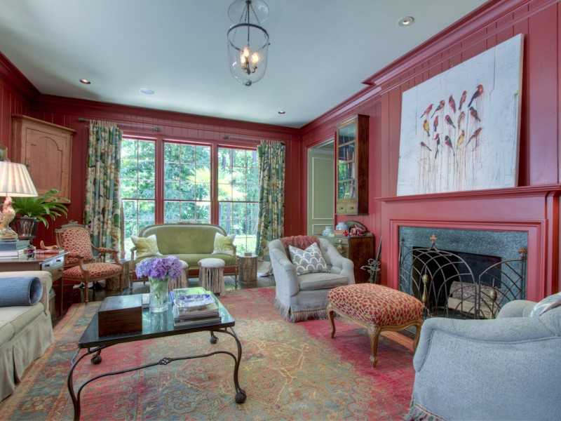 A living room filled with furniture and a large window