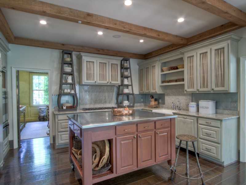 A kitchen with a wood floor