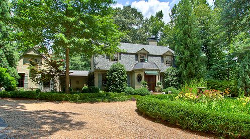 front exterior of Dutch Colonial style home for sale in Atlanta