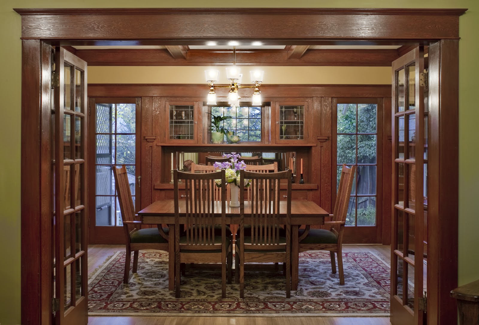 A dining room table in front of a window