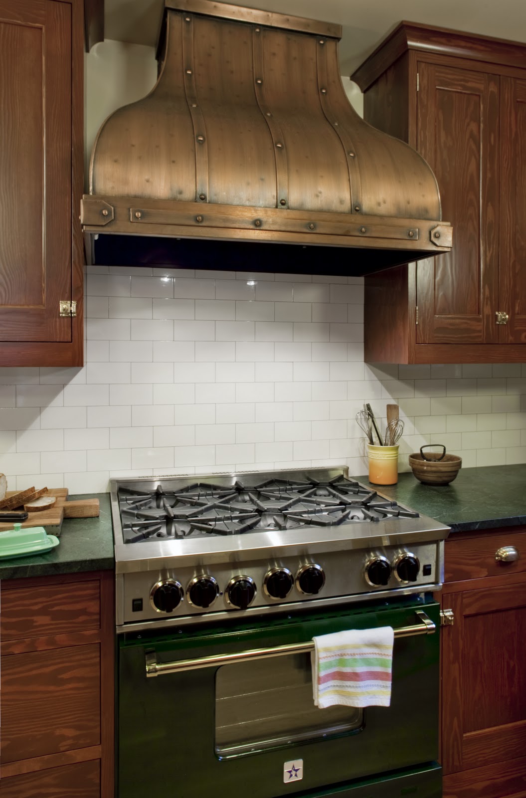 A stove top oven sitting inside of a kitchen