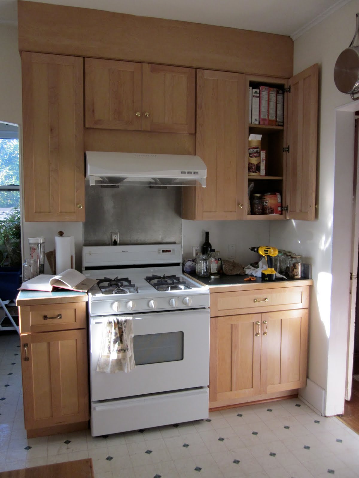 A stove top oven sitting inside of a kitchen