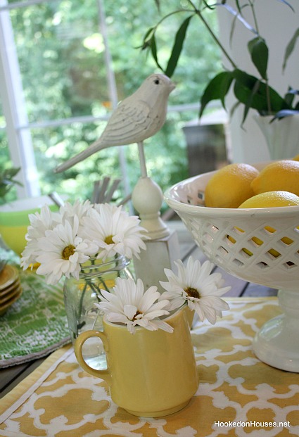 daisies lemons and bird on sunroom table