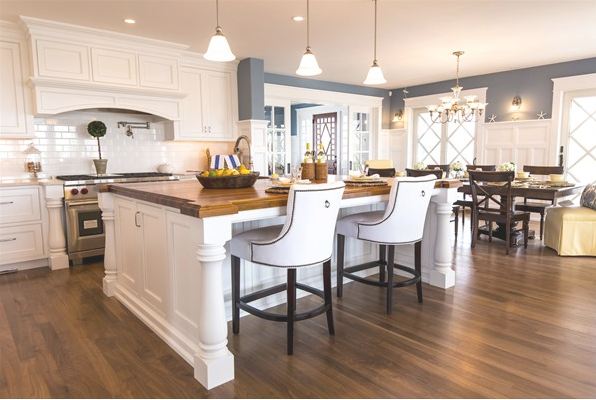 A kitchen with an island in the middle of a room