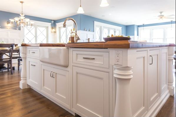 A kitchen with a sink and a window