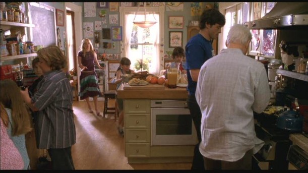 A group of people preparing food in a kitchen