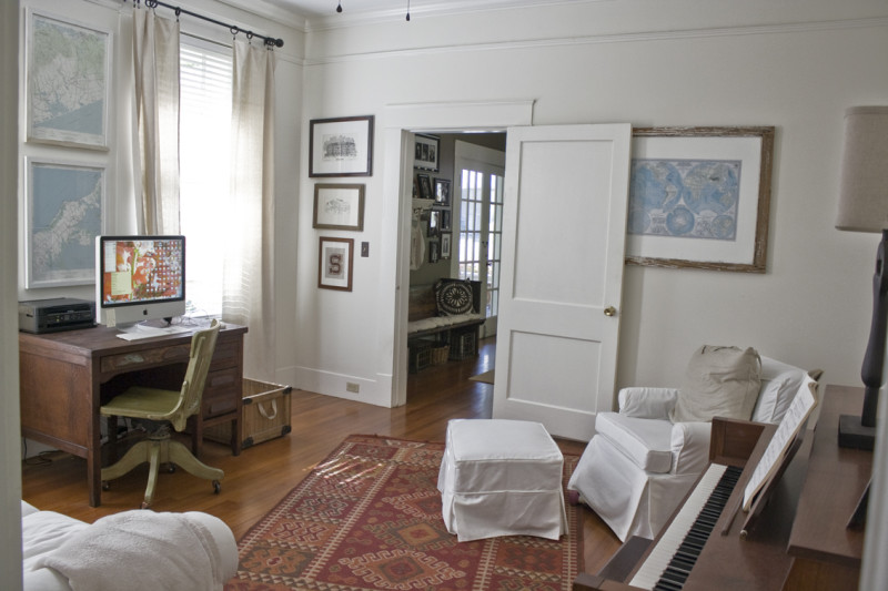 A living room filled with furniture and a large window