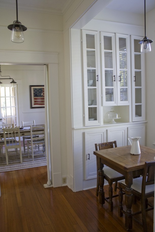 A dining room table in front of a window