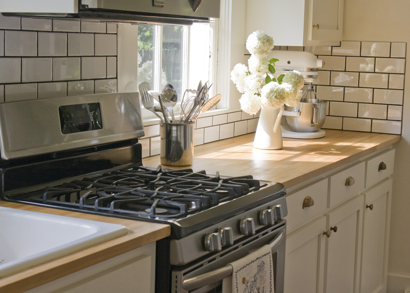 A stove top oven sitting inside of a kitchen