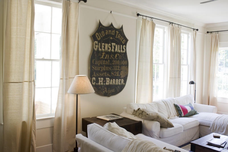 A living room with sign that says Glens Falls