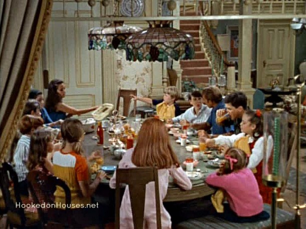 family sitting around large dining table