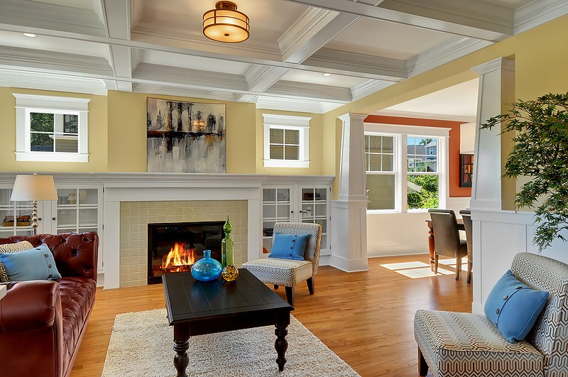 A living room filled with furniture and a fire place