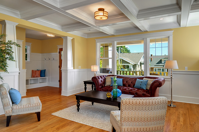 A living room filled with furniture and a large window