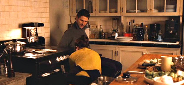 A person cooking in a kitchen preparing food