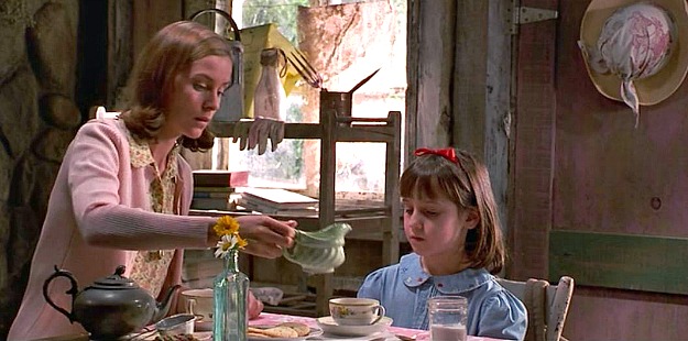 Matilda drinking tea in Miss Honey\'s cottage