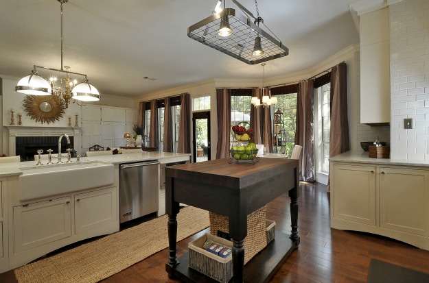 A kitchen with an island in the middle of a room