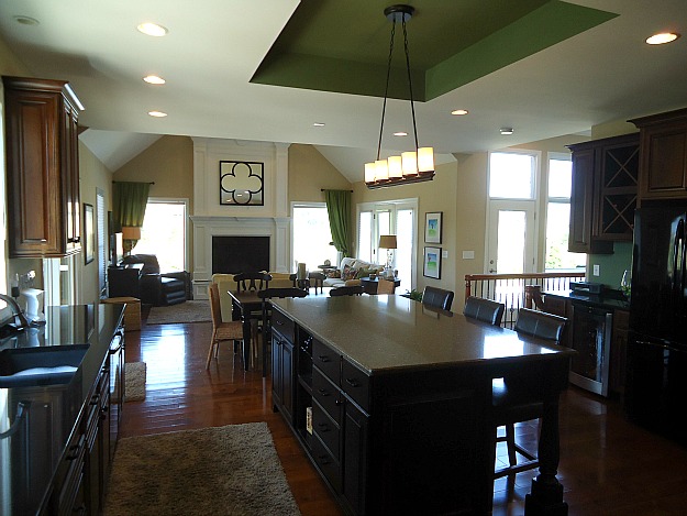 A kitchen with an island in the middle of a room