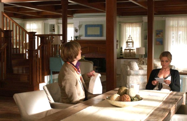 Emily and Nolan in her beach house-dining table