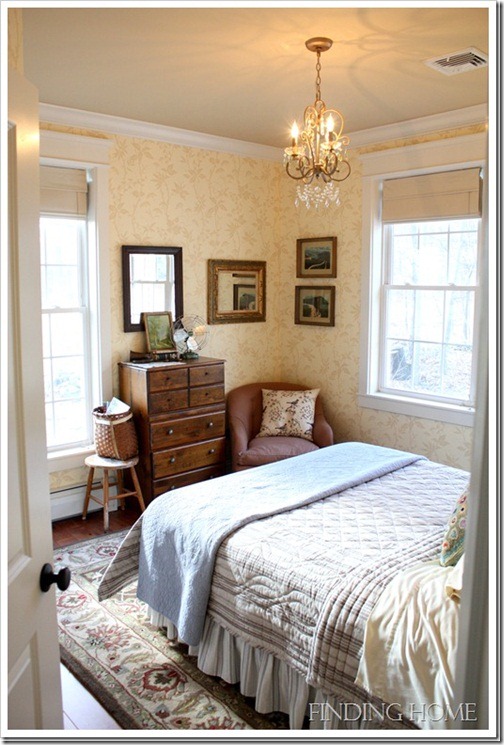 A bedroom with a large bed in a room