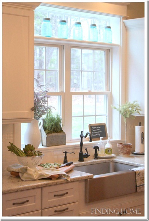 A kitchen with a sink and a window