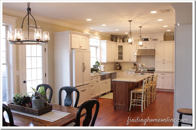 A kitchen with a dining room table