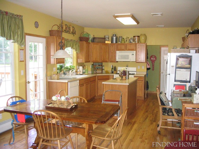 A kitchen with a dining room table