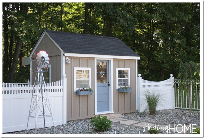 playhouse in backyard with window boxes 