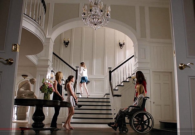 Grayson Manor foyer with double staircase