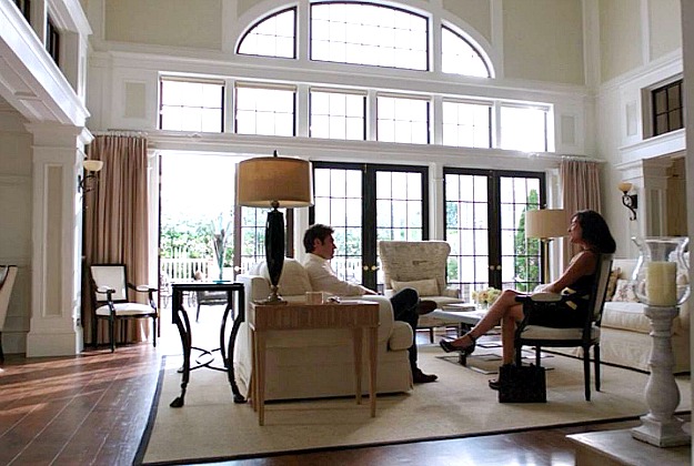 A living room filled with furniture and a large window