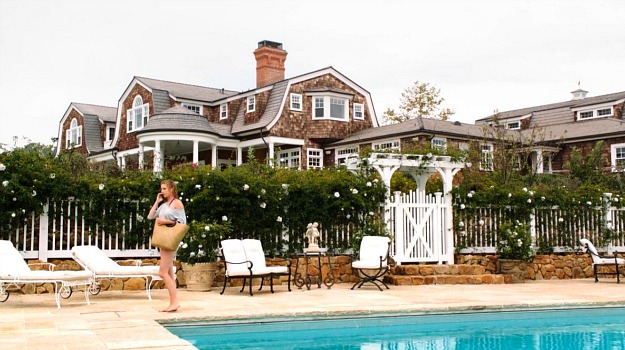 Emily standing by the pool