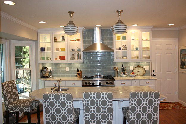 kitchen with blue gray subway tile on backsplash