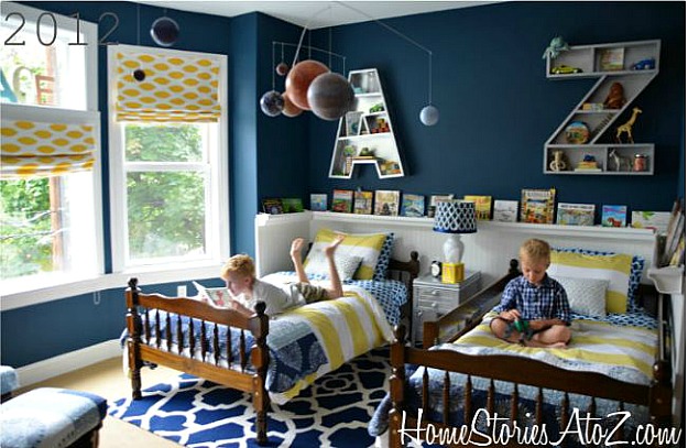 boys bedroom after makeover with teal blue walls and book rail