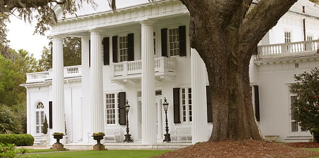 front exterior of Jodie Rivera\'s Southern Federal style house with pillars