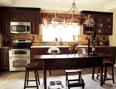 Jodie's newly remodeled kitchen with dark wood cabinets and island