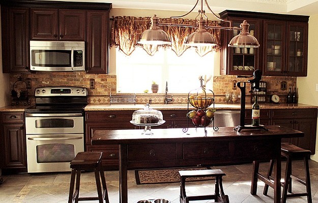 Jodie's newly remodeled kitchen with dark wood cabinets and island
