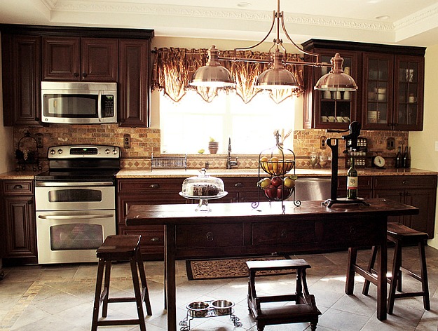 Jodie\'s newly remodeled kitchen with dark wood cabinets and island