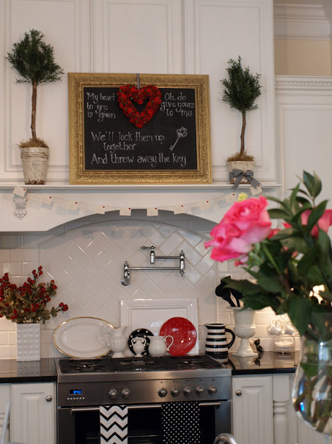 A vase of flowers on a kitchen counter