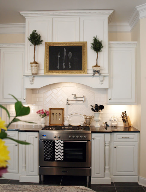 A kitchen with white cabinets