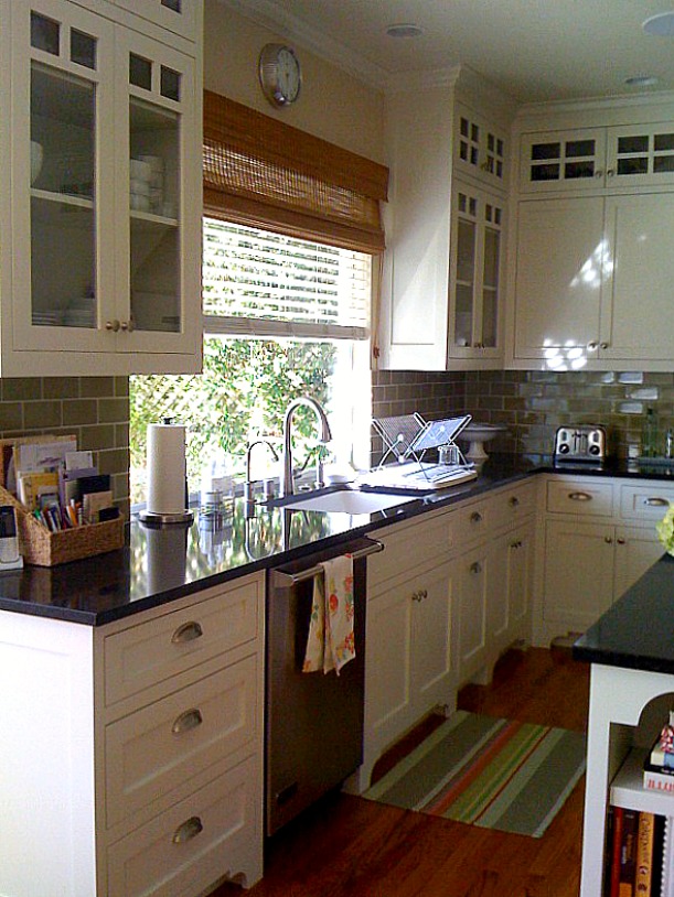 A kitchen with a sink and a window