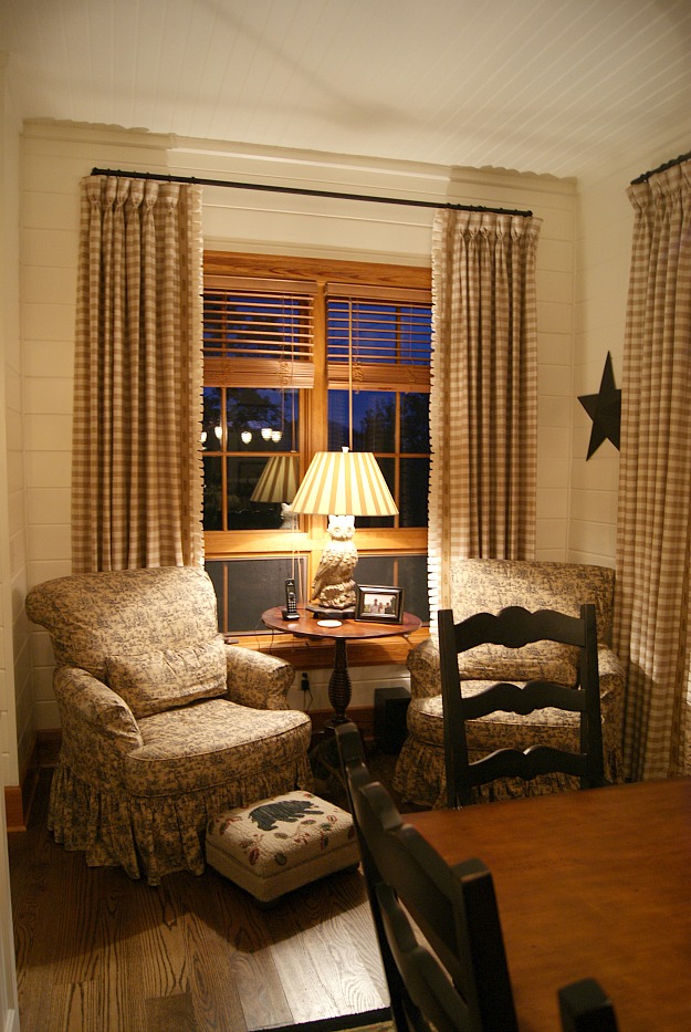 two upholstered armchairs in corner of kitchen