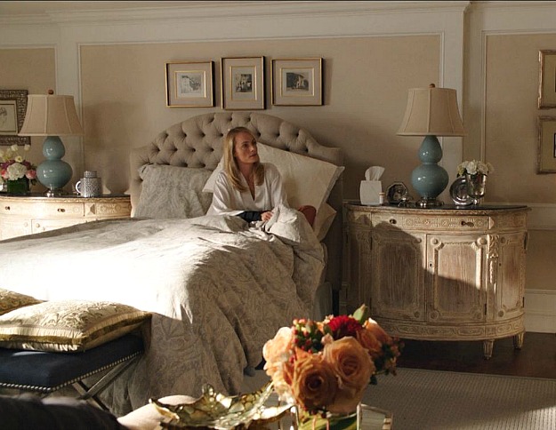 Lydia sitting in bed in the guest room