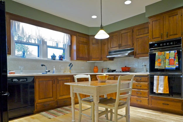 A modern kitchen with stainless steel appliances and wooden cabinets