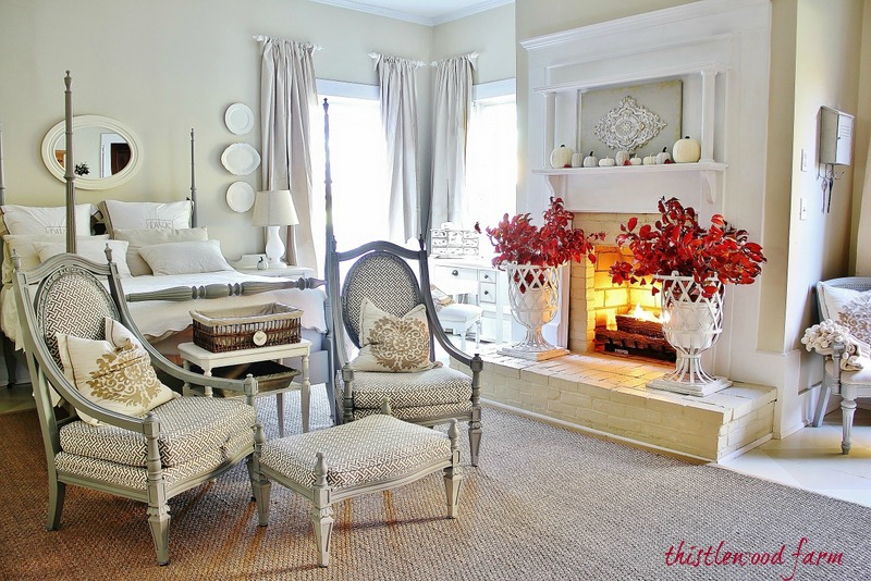 A bedroom filled with furniture and a fireplace