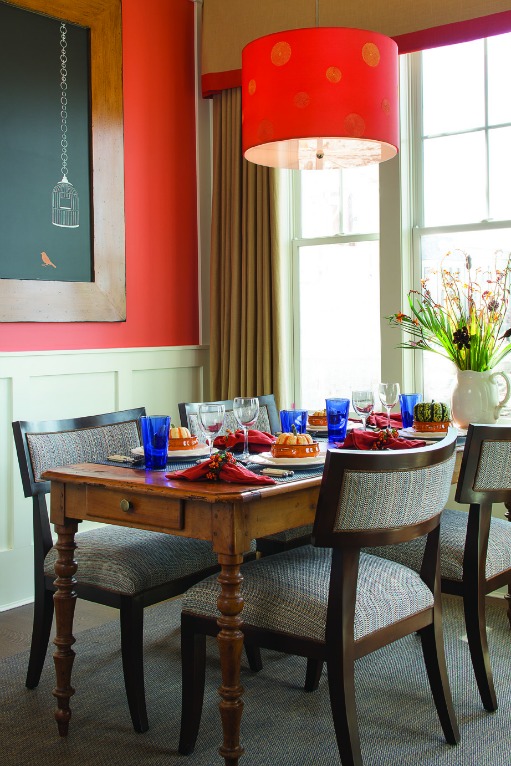 A dining room table in front of a window