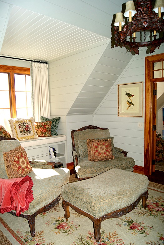 room with window seat and armchairs