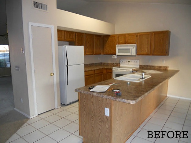 A kitchen with a tile floor before remodel